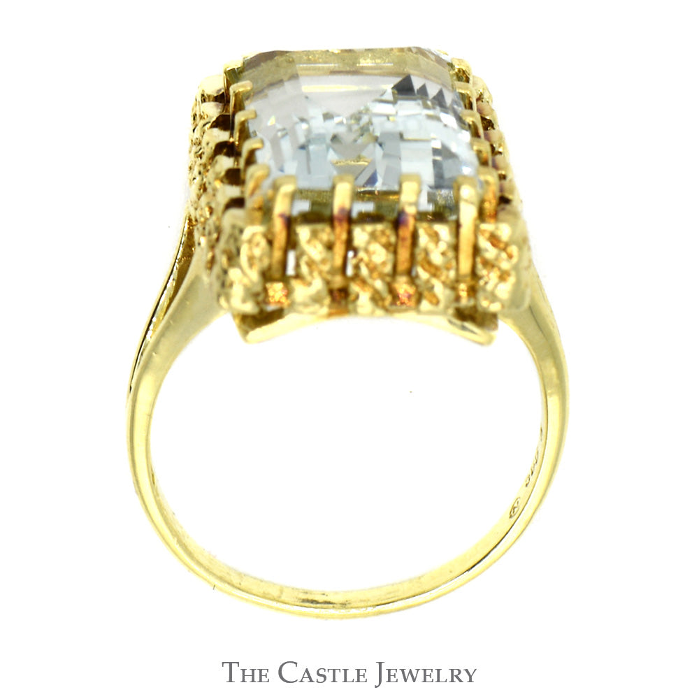 Emerald Cut Aquamarine Ring in 14k Yellow Gold Nugget Style Bezel