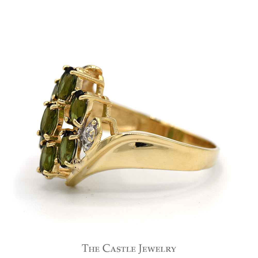Oval Tsavorite Garnet and Diamond Cluster Ring With .01 CTTW in Bypass Style 10 KT Yellow Gold