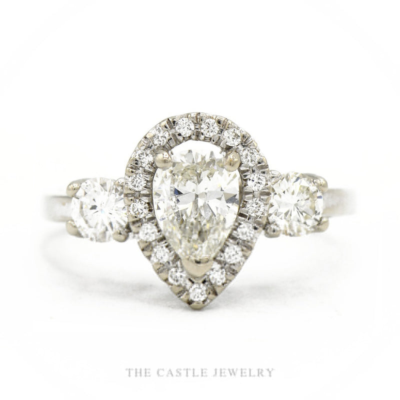 14k white gold pear-shaped diamond halo engagement ring with 0.71ct center and pavé shank — top view
