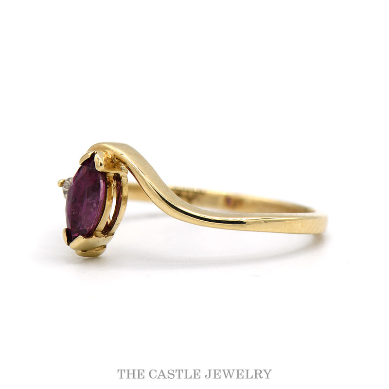 Marquise Ruby Solitaire Ring with Diamond Accent in 10k Yellow Gold Swirled Bypass Mounting
