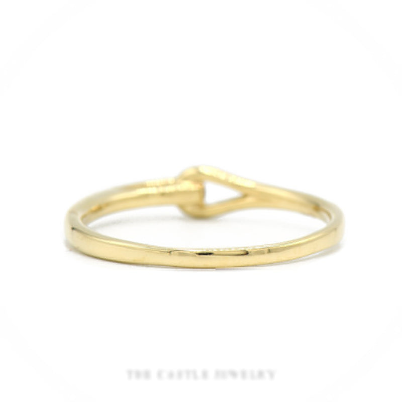 Front-facing view of the 10k yellow gold diamond ribbon band showing pavé stripe and looped openwork