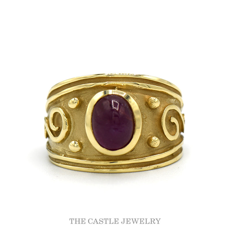 14k yellow gold wide brushed band ring with oval cabochon ruby — top view