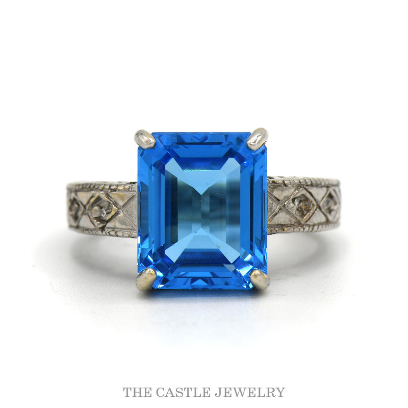 14k white gold emerald cut blue topaz ring with engraved band — top view