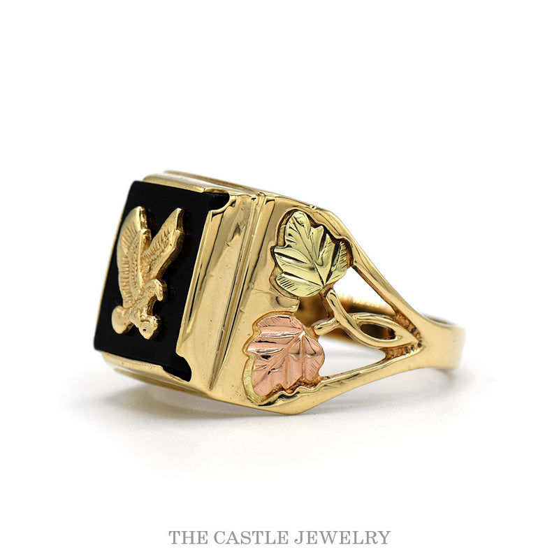 Side profile of the black onyx eagle ring showing the pierced tri gold leaf shoulders