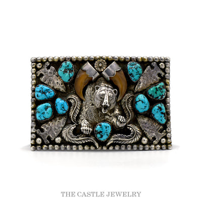 Sterling silver bear belt buckle with silver-capped claws, nugget turquoise, arrowheads and feathers — front