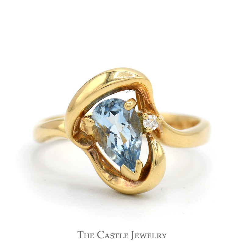 Pear Shaped Blue Topaz Ring with Diamond Accent in Freeform Swirled 14k Yellow Gold Mounting