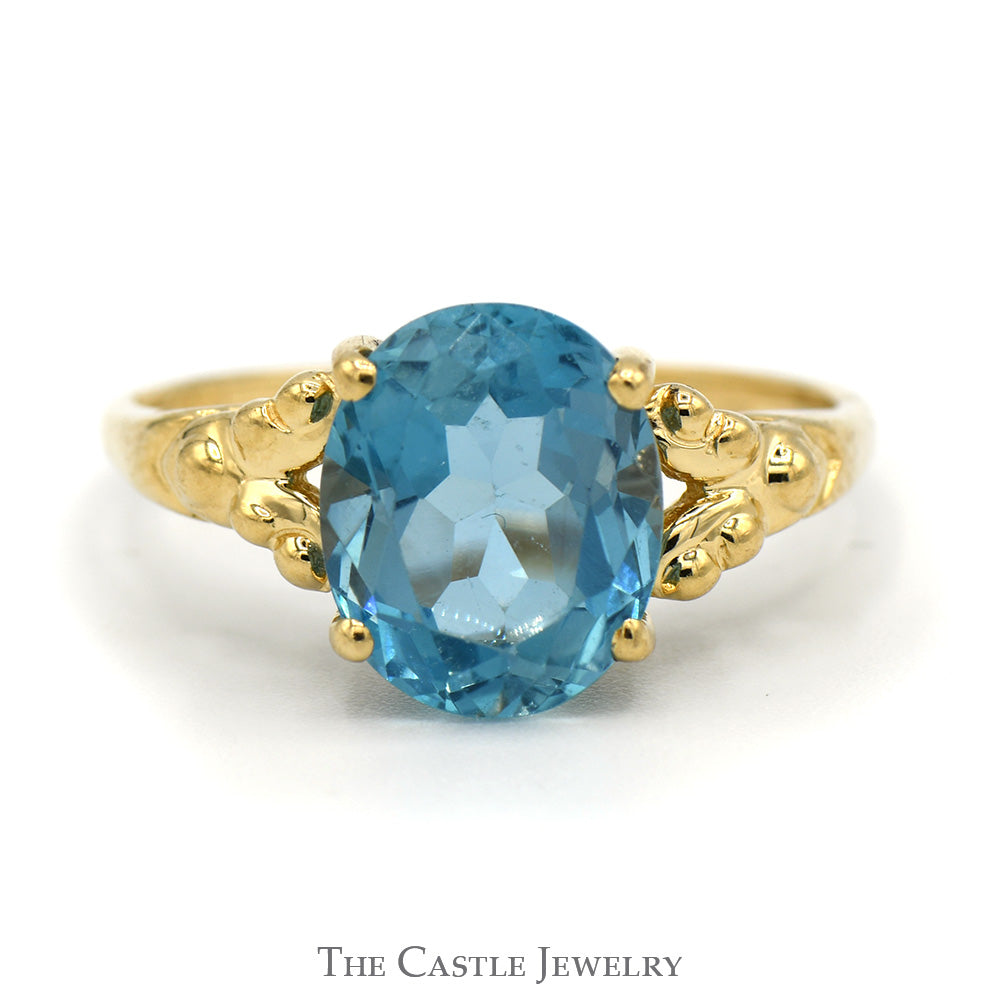 Oval Blue Topaz Ring with Beaded Split Sides in 14k Yellow Gold