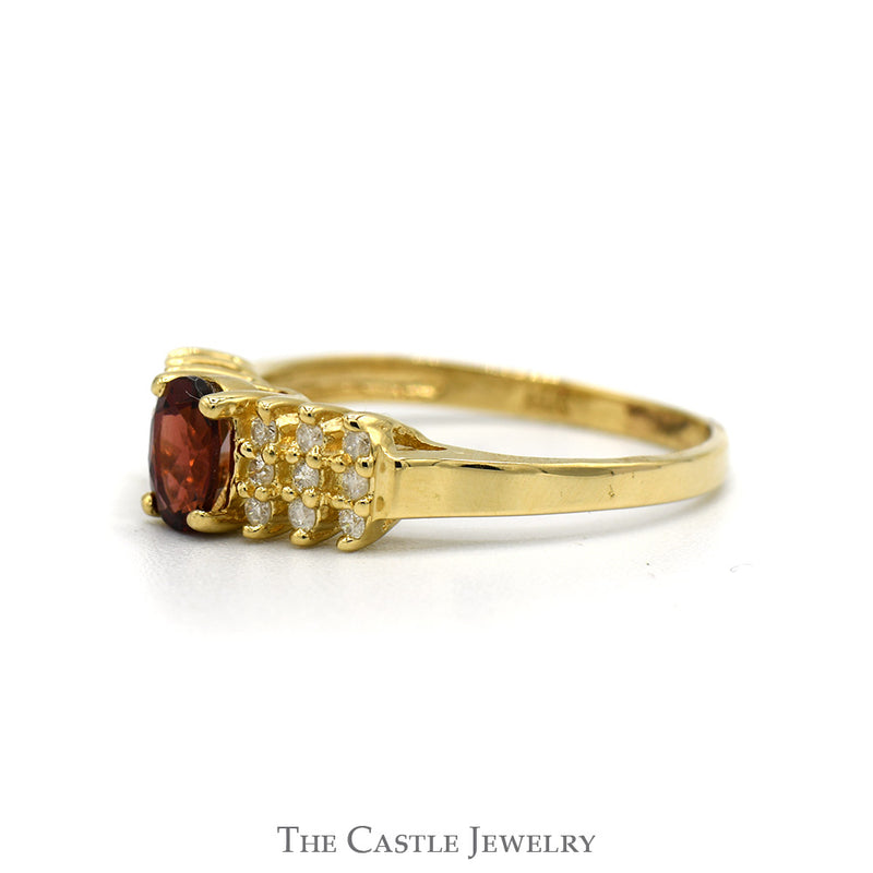Oval Cut Garnet And Diamond Ring With .18 CTTW Diamonds In 14KT Yellow Gold