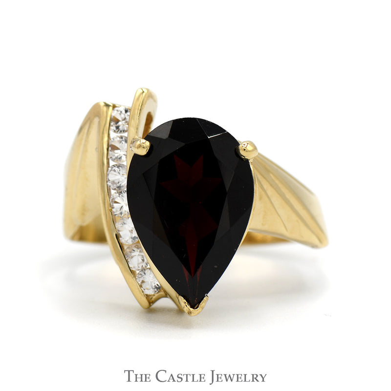 Pear Cut Garnet Ring with White Sapphire Accents in 10k Yellow Gold Bypass Mounting