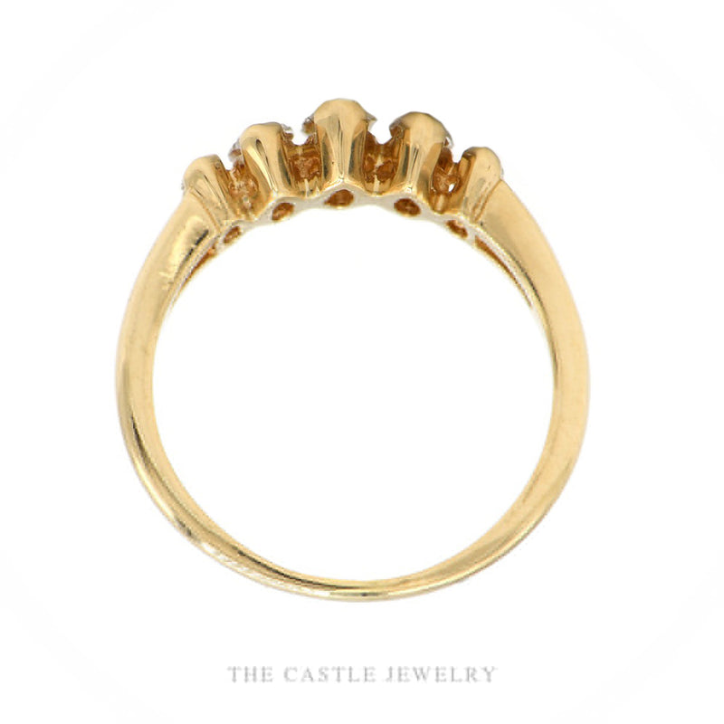 Front-facing view of the 14k yellow gold graduated marquise diamond band