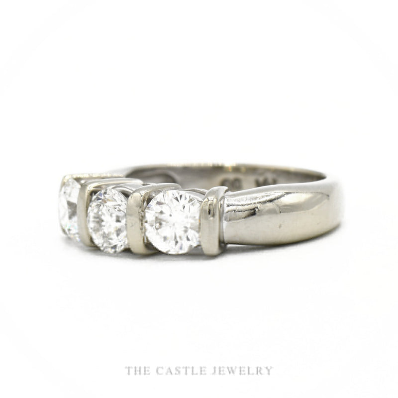Side profile of the 14k white gold three-stone tension-set band showing open-side diamond exposure