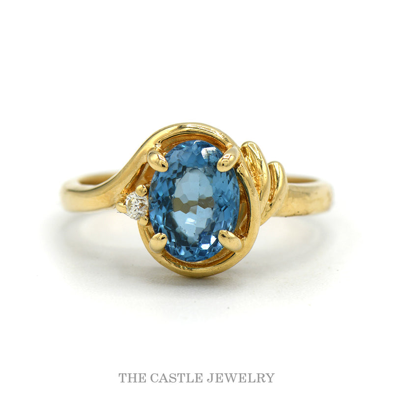 14k yellow gold oval blue topaz bypass ring — top view