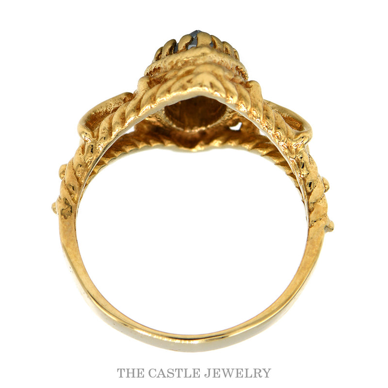 Front-facing view of the 10k yellow gold marquise aquamarine ring