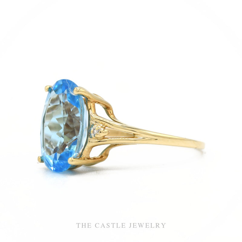 Side profile of the 10k yellow gold blue topaz ring showing setting height and split shank