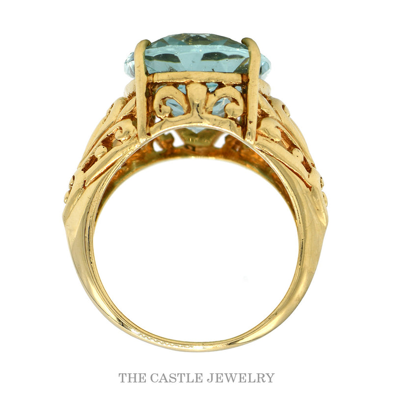 Front-facing view of the 10k yellow gold oval blue topaz ring