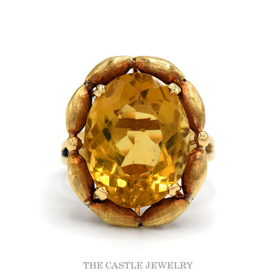 Large oval citrine ring with scalloped brushed gold frame and split shank in 10k yellow gold — top view