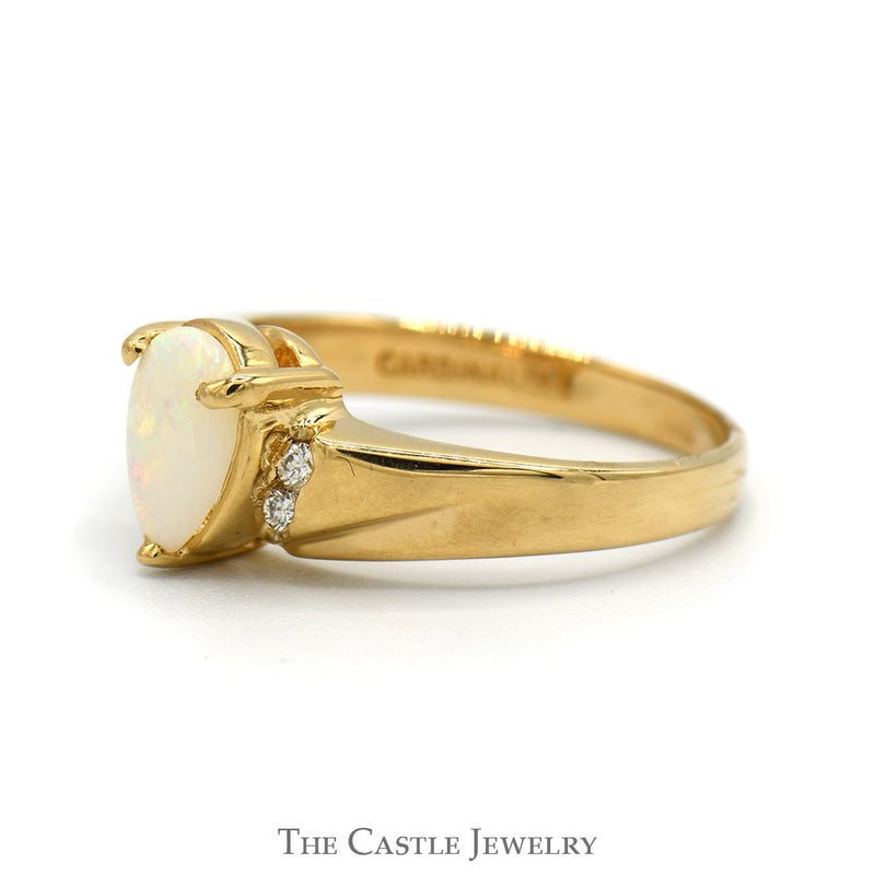 Pear Cut Opal ring with Diamond Accented Sides in 14k Yellow Gold
