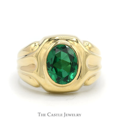 Oval Bezel Set Synthetic Emerald Ring with Concaved Grooved Sides in 10k Yellow Gold