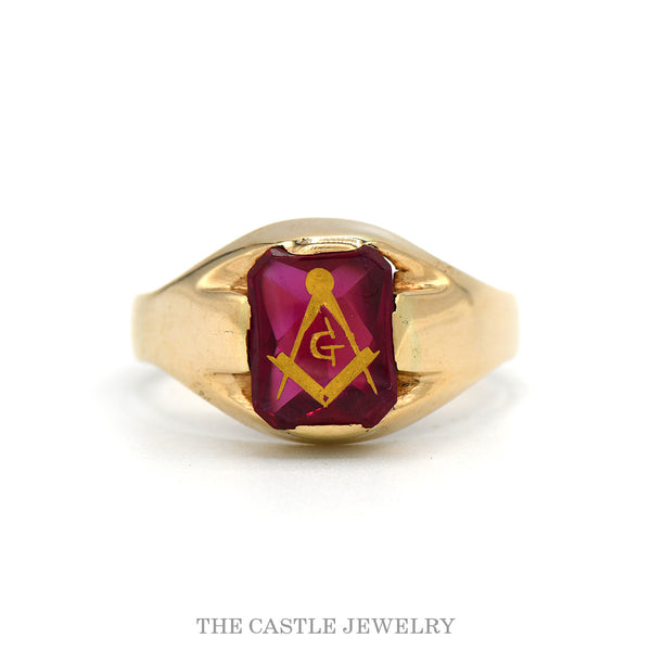 10k yellow gold square and compass Masonic ring on red stone — top view