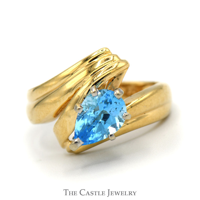 Pear Cut Blue Topaz Ring with Ridged Bypass Sides in 14k Yellow Gold