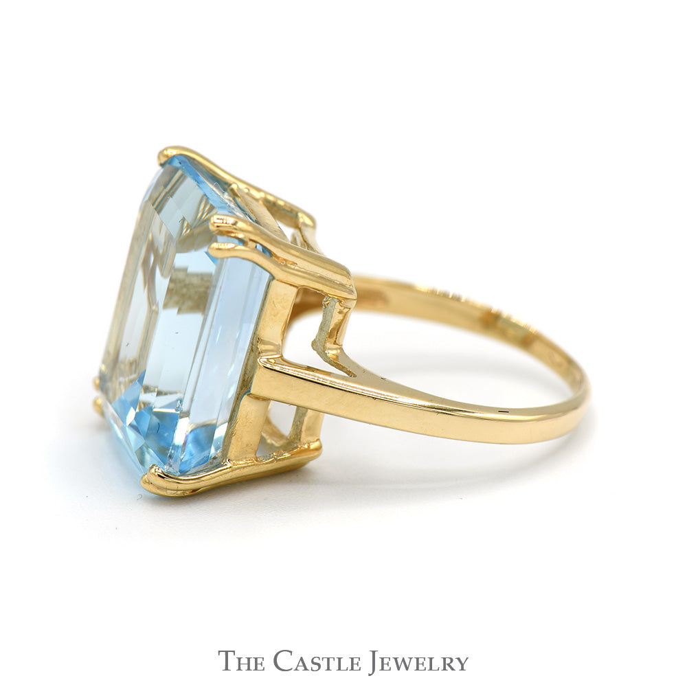 Emerald Cut Blue Topaz Ring in 10k Yellow Gold Cathedral Mounting - Main Image