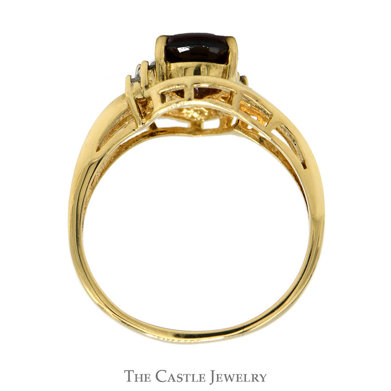 Pear Cut Garnet Ring with Illusion Set Diamond Accents in 10k Yellow Gold