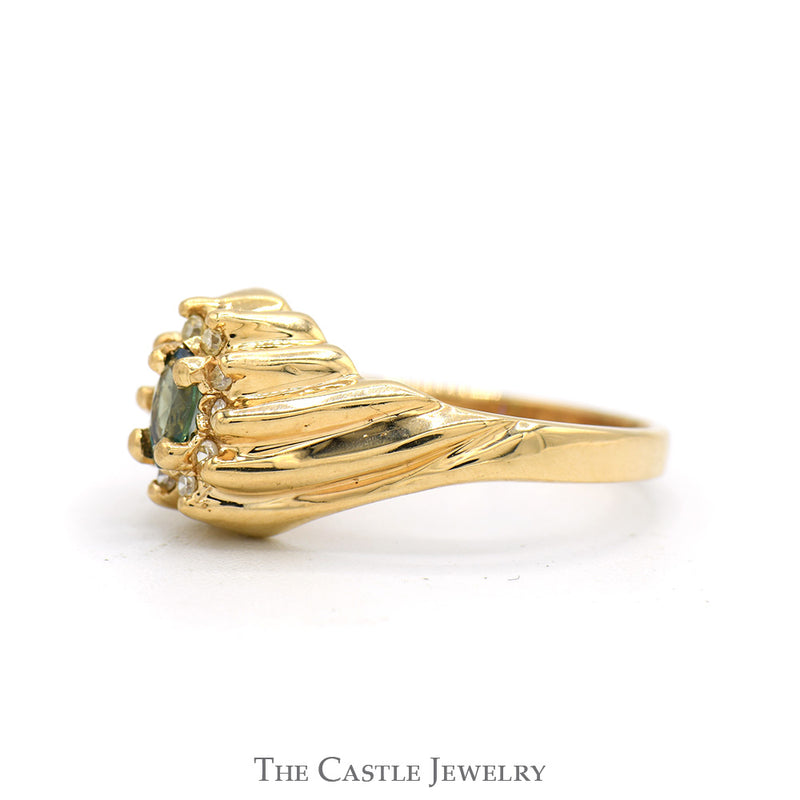 Oval Cut Emerald Ring with Round Diamond Halo and Swirled Ridged Sides in 14k Yellow Gold