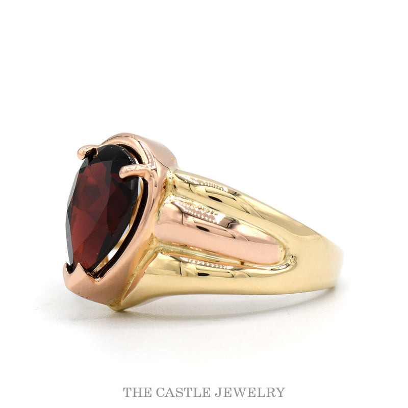Side profile of the 14k yellow gold pear garnet ring showing grooved shoulders