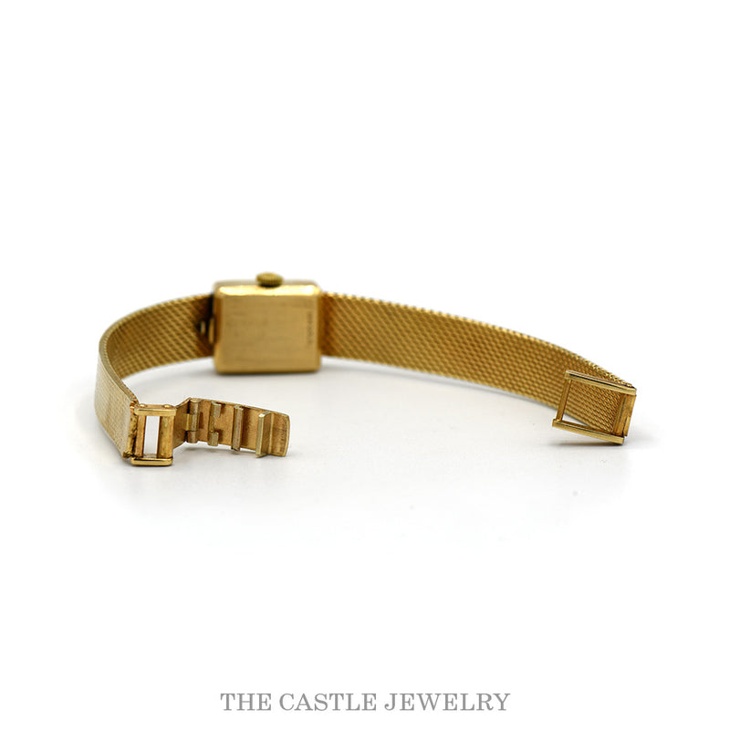 The 14k yellow gold mesh bracelet open at the clasp