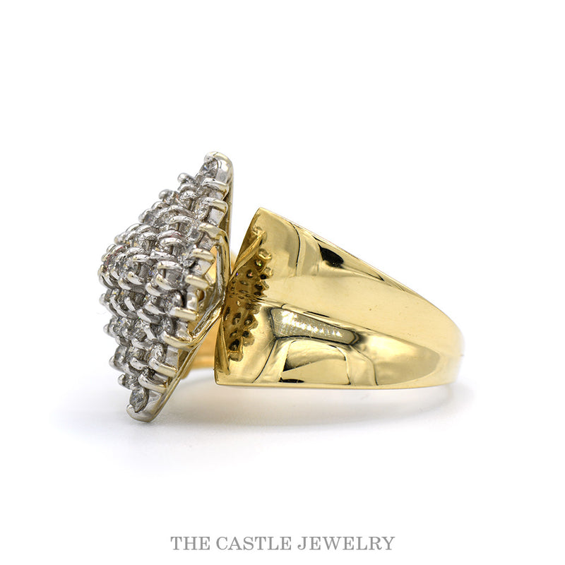 Side profile of the 14k yellow gold marquise cluster ring showing the concaved shoulders