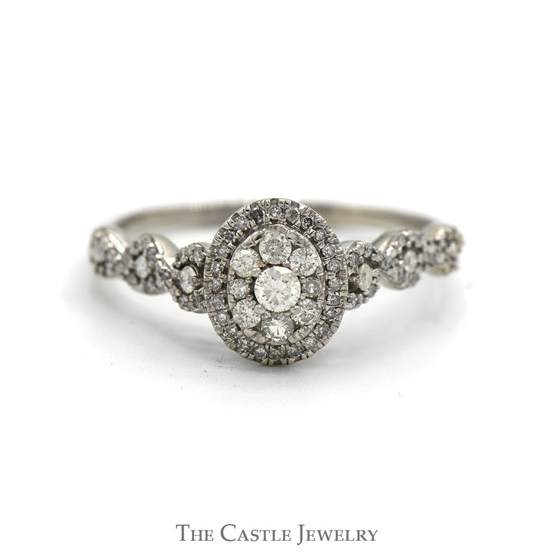 1/2cttw Oval Shaped Round Diamond Cluster Ring with Accented Twisted Sides in 10k White Gold Cathedral Mounting