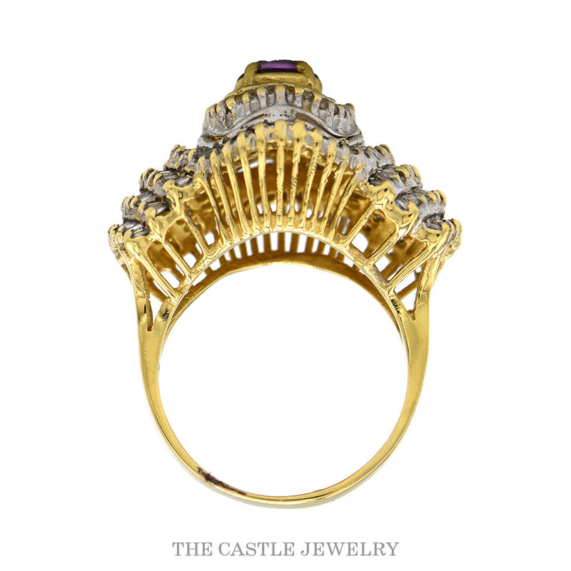 Front-facing view of the oval rhodolite garnet ballerina ring with fanning baguette diamond rows in 14k yellow gold