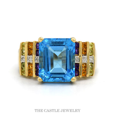 14k yellow gold emerald cut blue topaz ring with multi-gem sides — top view