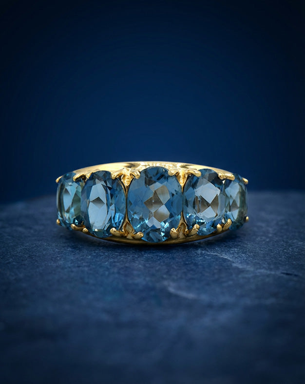5 Oval Blue Topaz Band Ring in 10k Yellow Gold