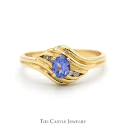 Oval Tanzanite Ring with Diamond Accented Sides in 14k Yellow Gold