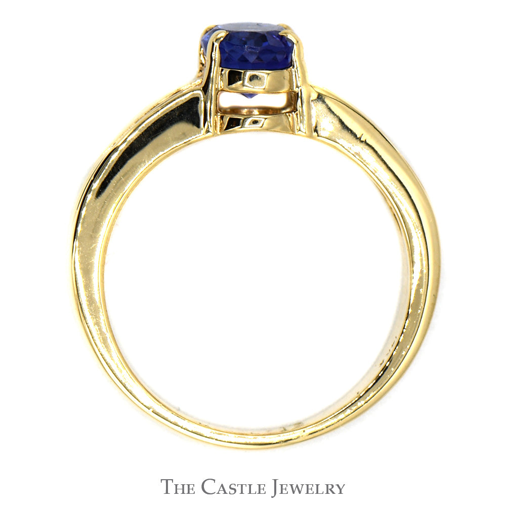 Oval Tanzanite Ring with Channel Set Round Diamond Accents in 14K Yellow Gold