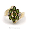 Oval Tsavorite Garnet and Diamond Cluster Ring With .01 CTTW in Bypass Style 10 KT Yellow Gold - Thumbnail 1
