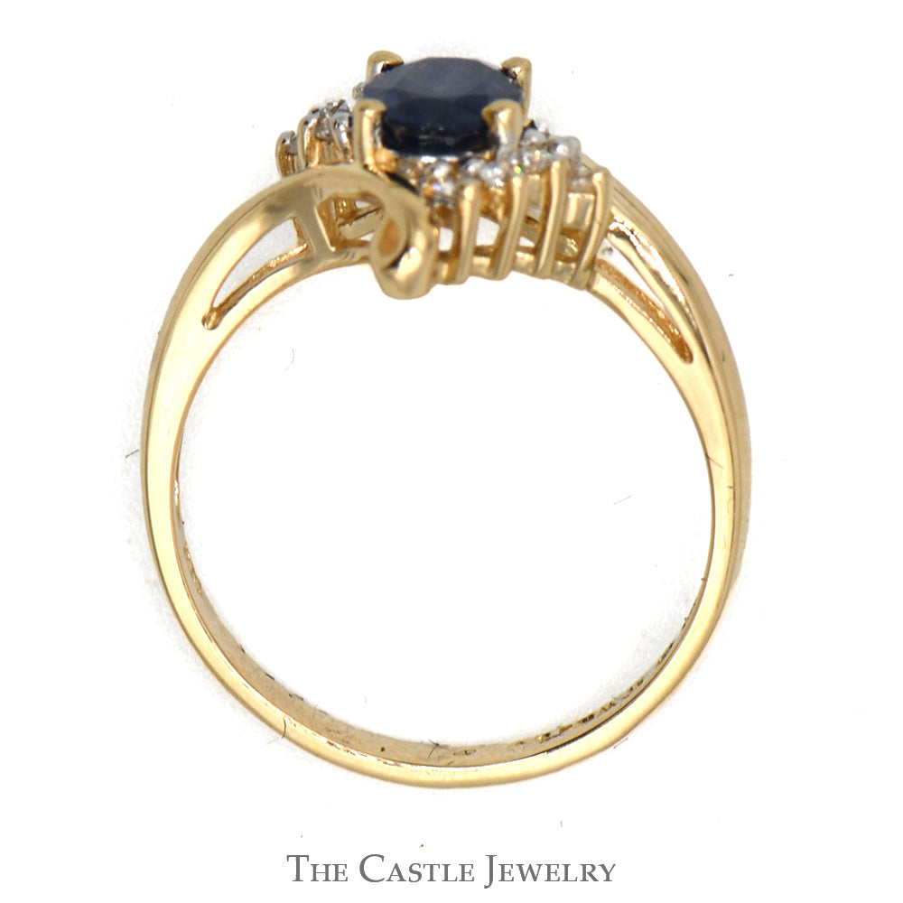 Oval Sapphire Ring With .05 CTTW of Diamonds in Bypass Design 14 KT Yellow Gold