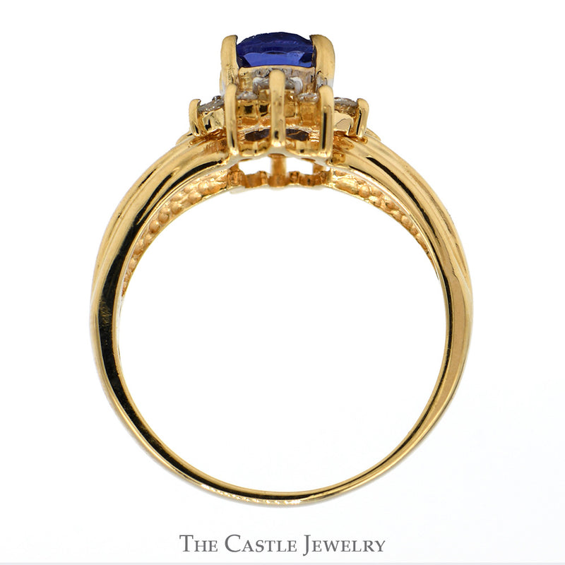 Oval Tanzanite Ring with Diamond Accents in Open 14k Yellow Gold Mounting