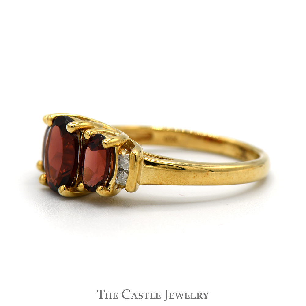 3 Stone Oval Garnet Ring with Diamond Accents in 10k Yellow Gold