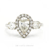 14k white gold pear-shaped diamond halo engagement ring with 0.71ct center and pavé shank — top view - Thumbnail 1