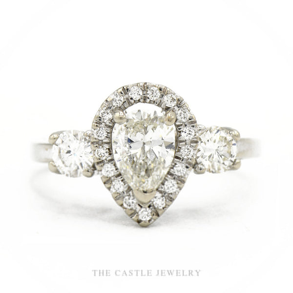14k white gold pear-shaped diamond halo engagement ring with 0.71ct center and pavé shank — top view
