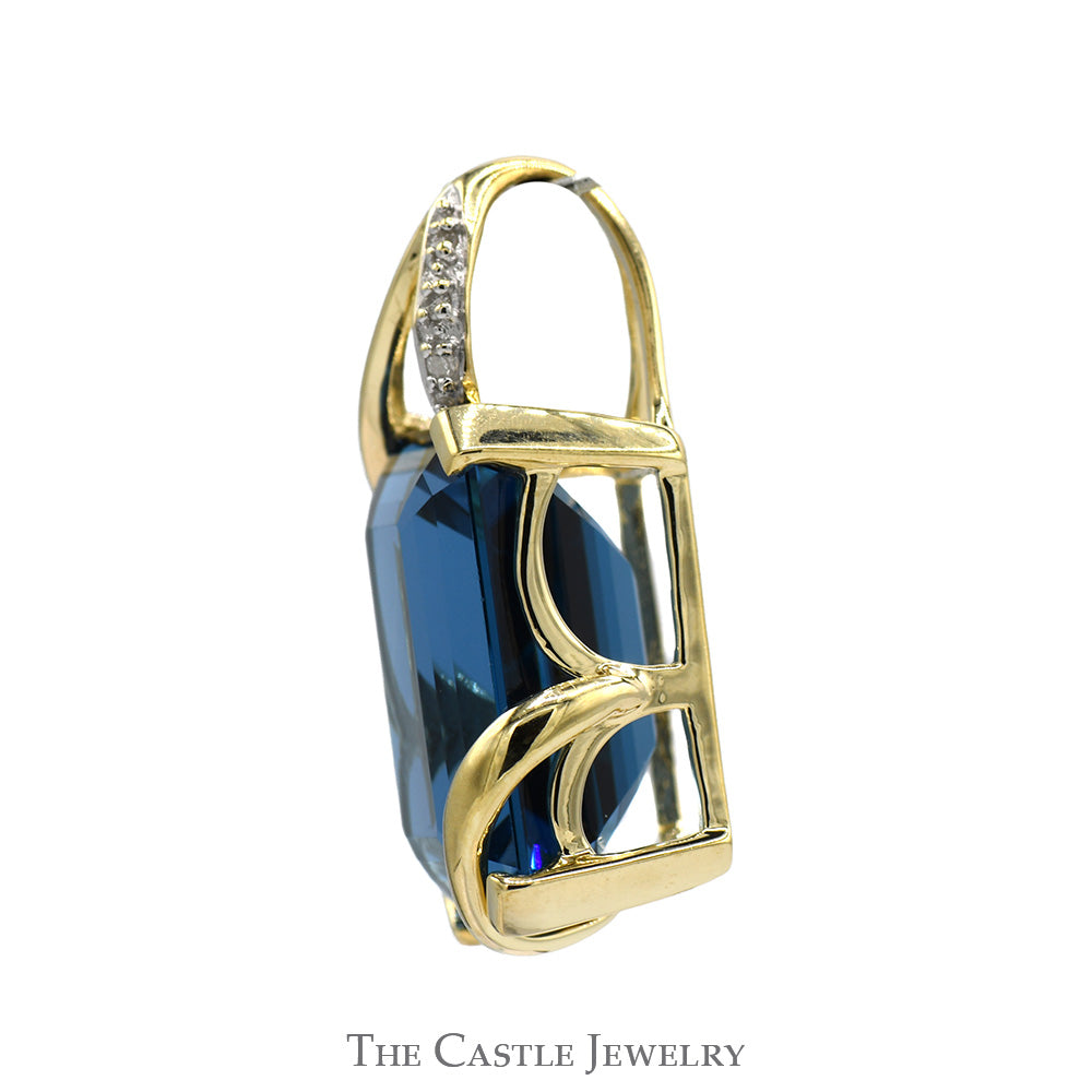 Emerald Cut Blue Topaz Pendant with Diamond Accents in 10k Yellow Gold Open Swirled Setting