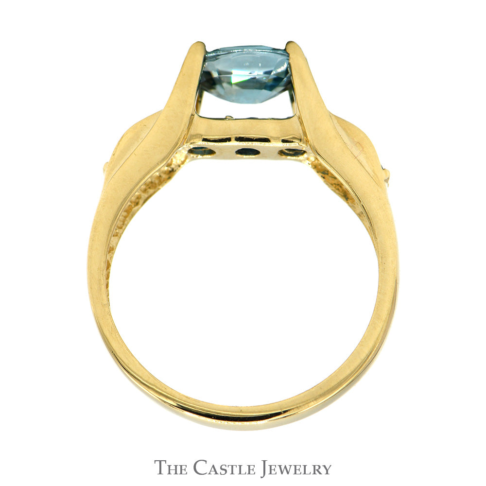 Oval Blue Zircon Ring with Blue Topaz Sides in 14k Yellow Gold Bridge Designed Mounting