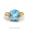 Oval Blue Topaz Ring with Diamond Accented Sides in 10k Yellow Gold - Thumbnail 1