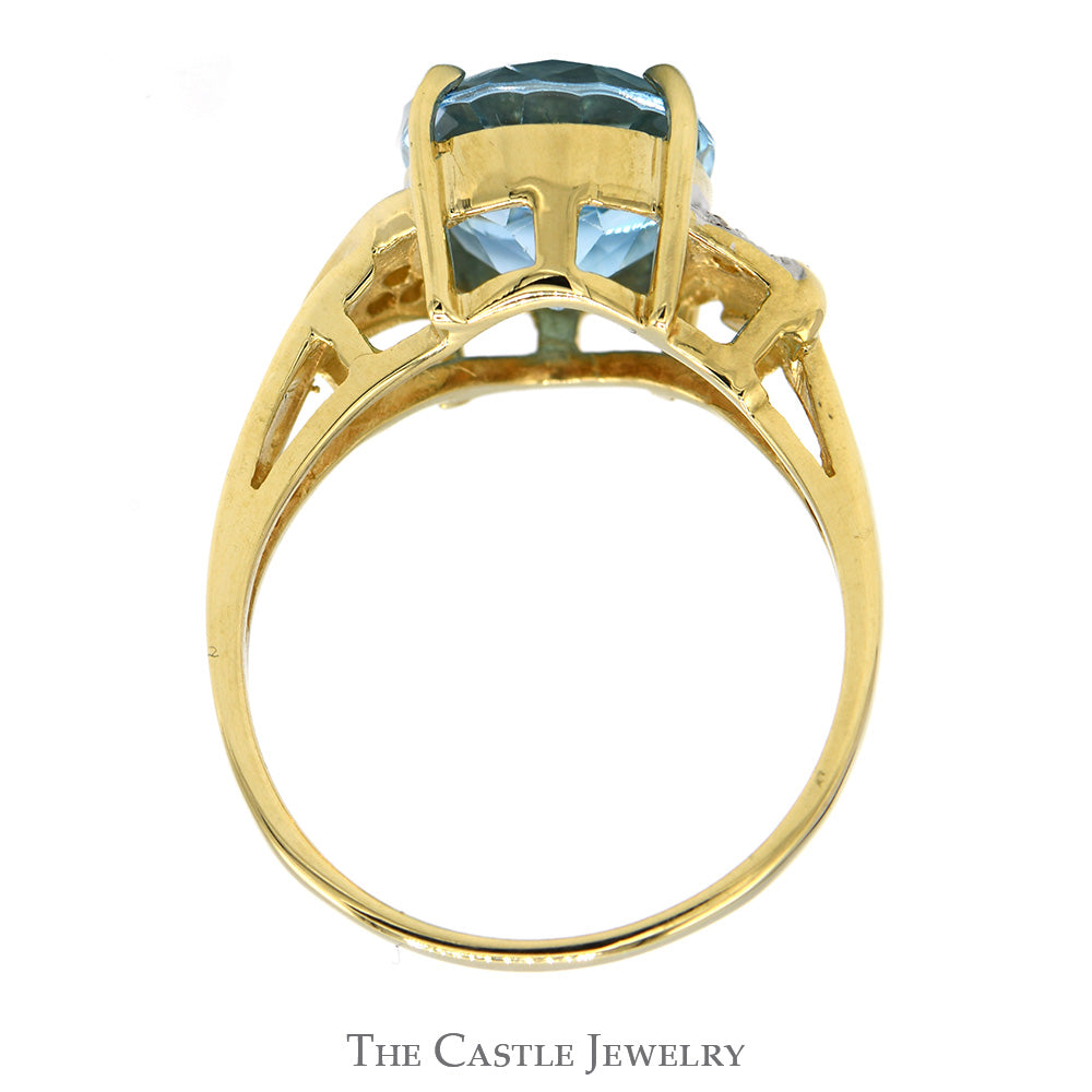 Oval Blue Topaz Ring with Diamond Accented Sides in 10k Yellow Gold