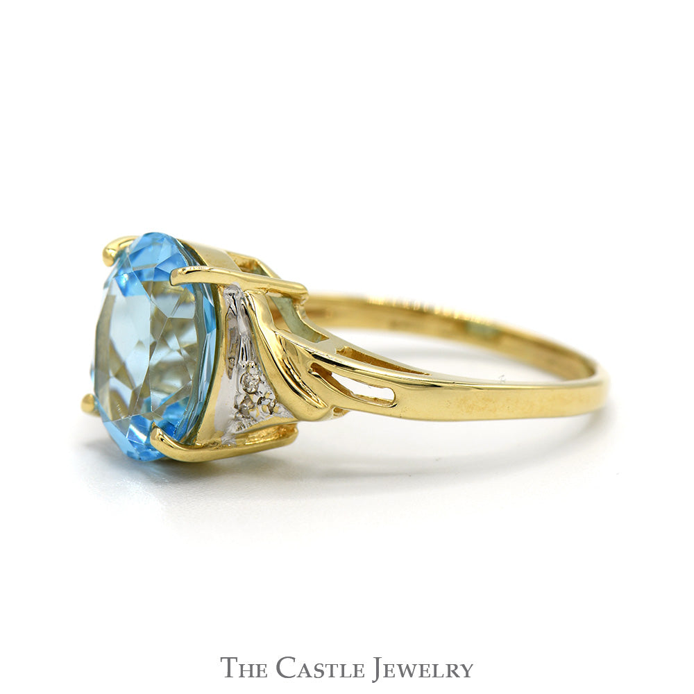 Oval Blue Topaz Ring with Diamond Accented Sides in 10k Yellow Gold