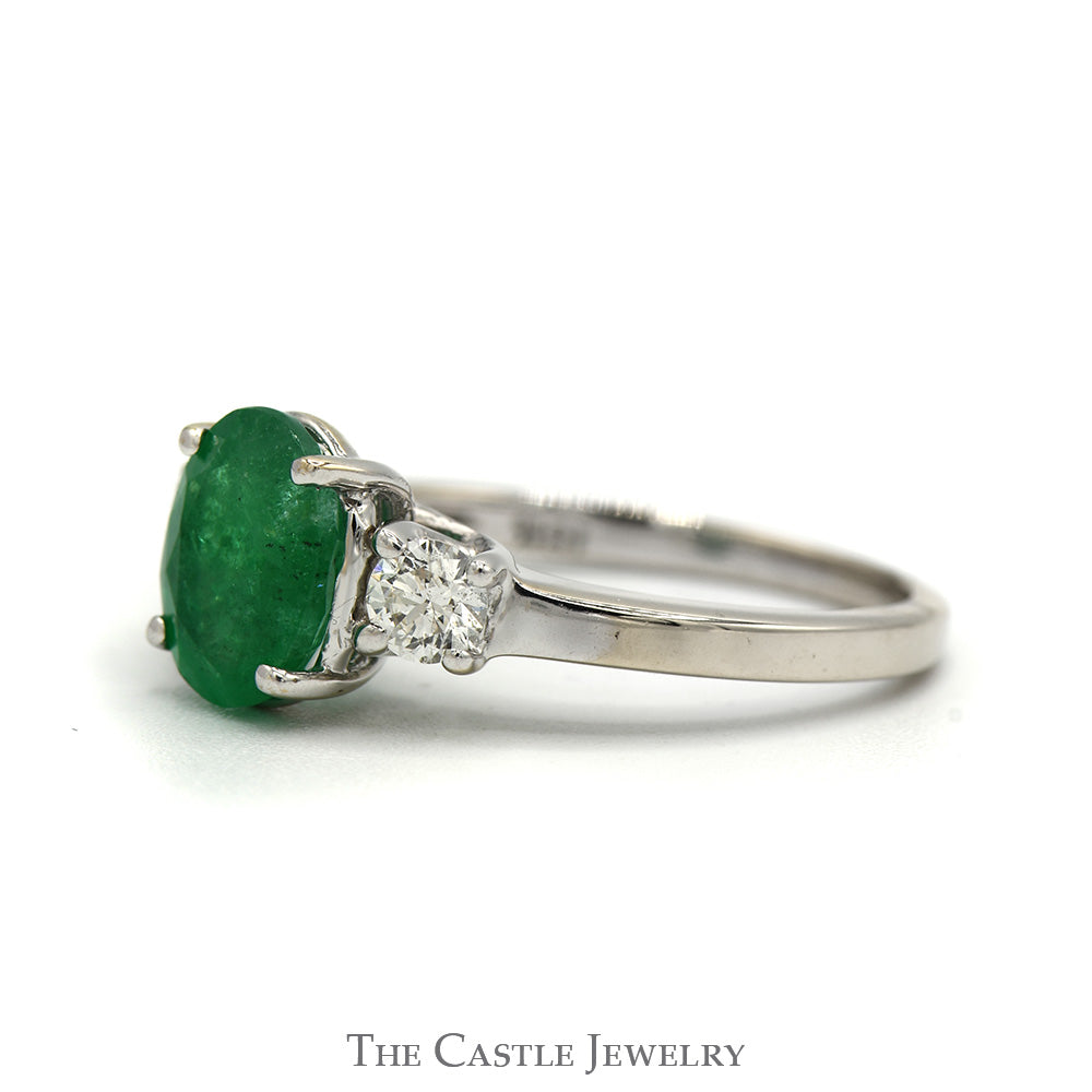 Oval Cut Emerald Ring with Diamond Accented Sides in 18k White Gold