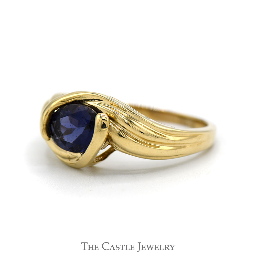 Side Set Oval Tanzanite Ring in 10k Yellow Gold Bypass Setting