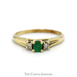 Three Stone Oval Emerald & Round Diamond Ring in 10k Yellow Gold